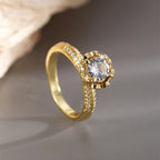 angled solitaire ring with scalloped setting and clear shoulders