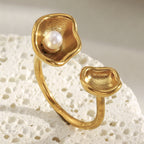 front view of the asymmetric gold plated shell and pearl ring