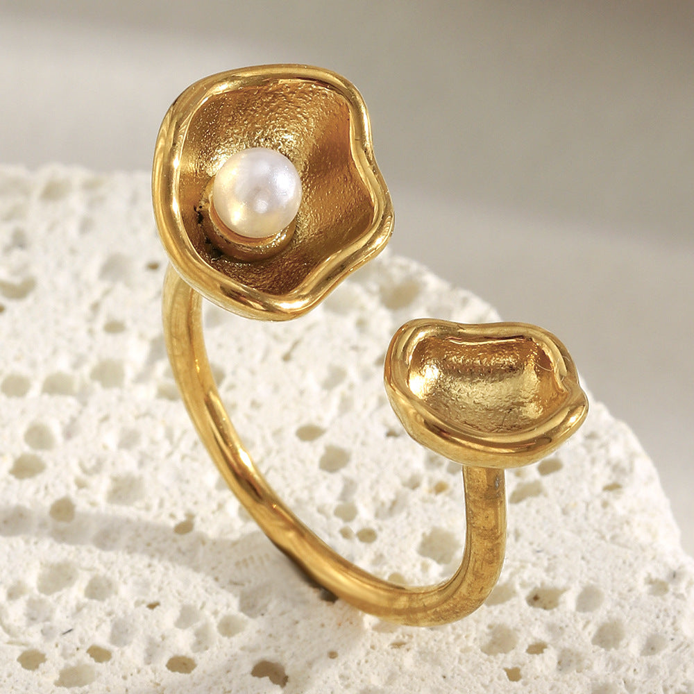 front view of the asymmetric gold plated shell and pearl ring