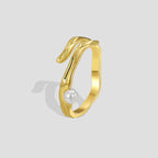 gold plated brass sculptural ring with a single shell pearl