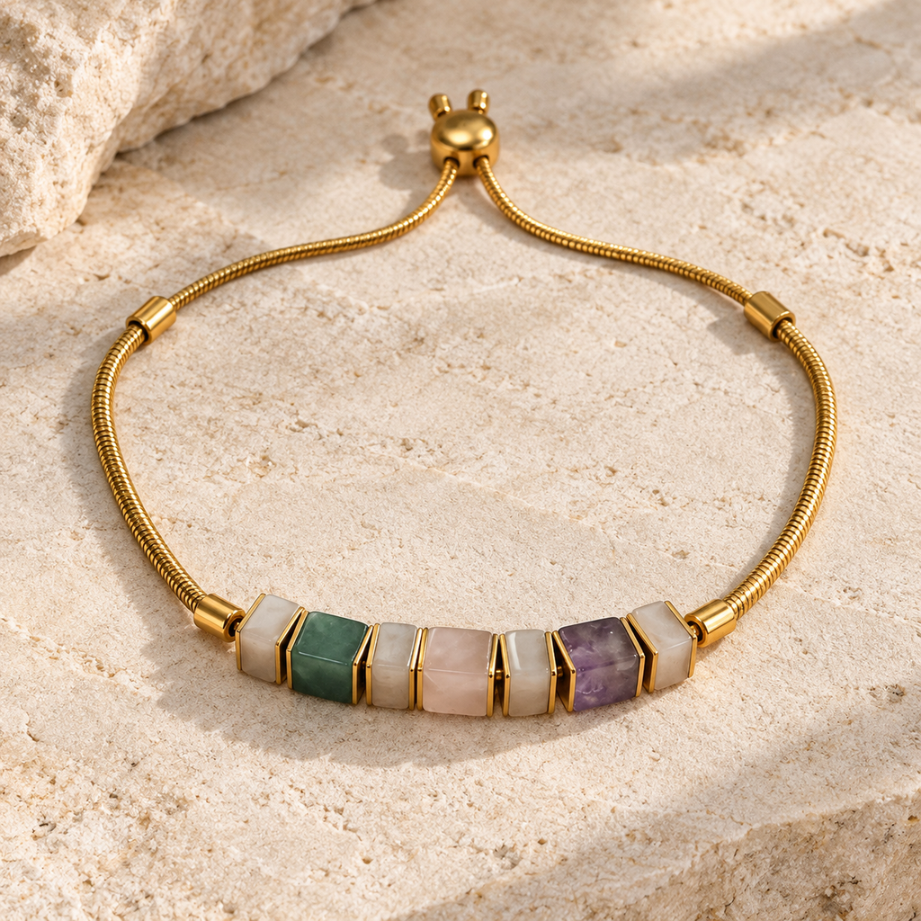 Gold plated 316L stainless steel bracelet with seven natural stone beads and an adjustable slider