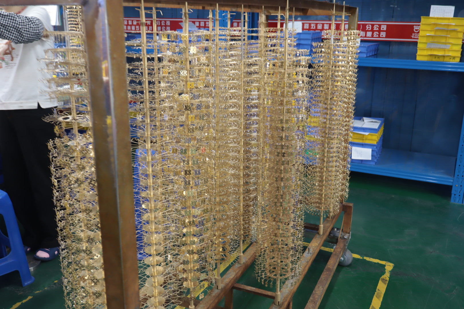 Gold plated jewelry on production racks before finishing inspection