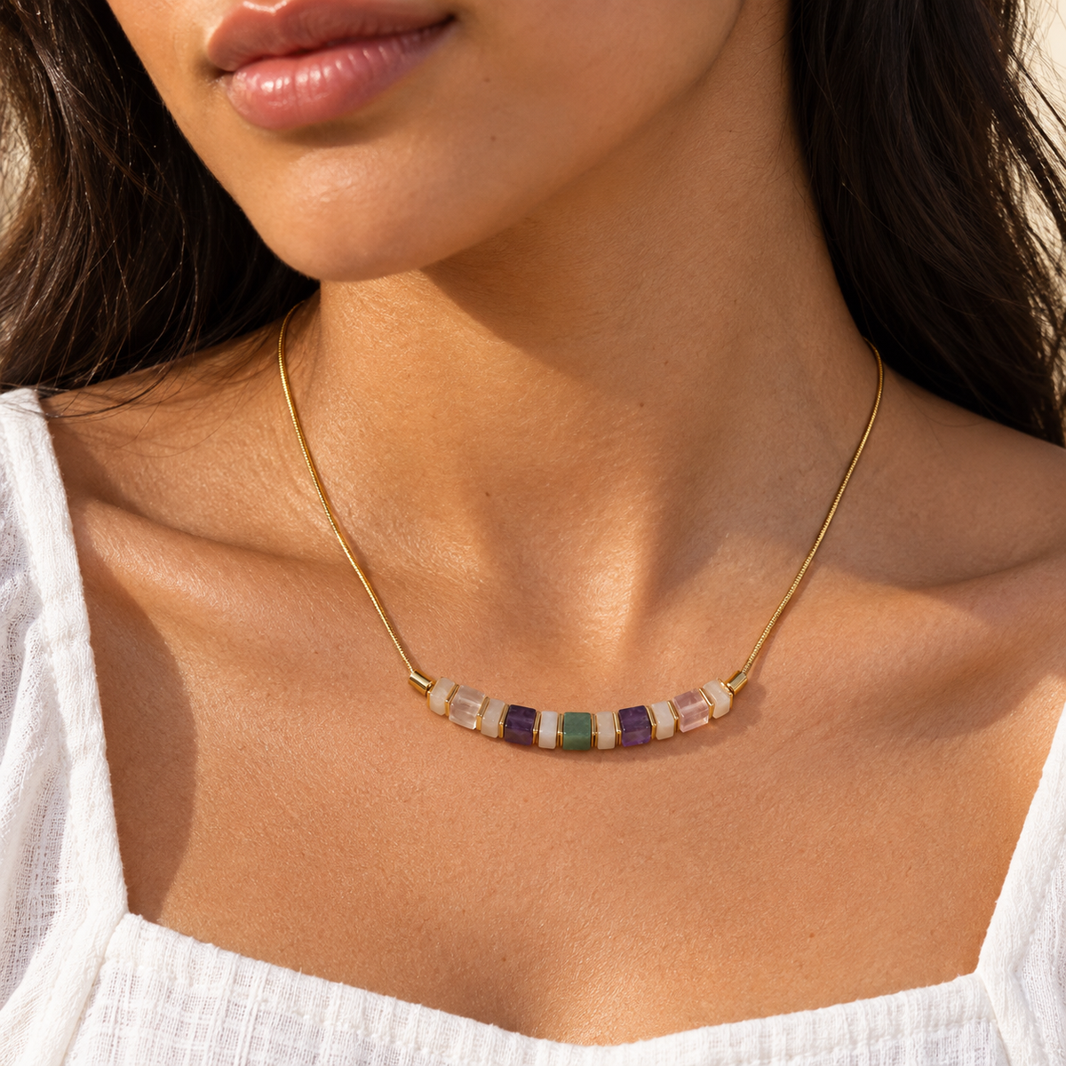 Natural stone snake chain necklace shown worn at the collarbone