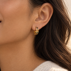 Small gold plated titanium alloy natural stone huggie earring shown worn on the ear